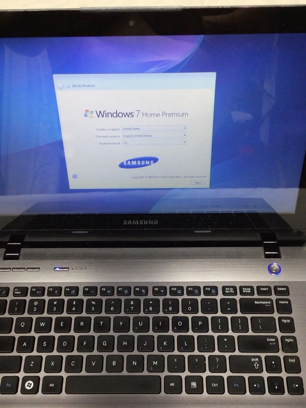 Samsung Silver and Black Laptop with Windows 7 Setup Screen